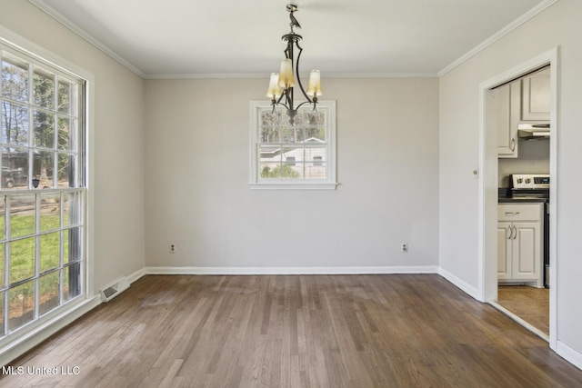 5360 Wayneland Dr, Jackson, MS 39211 - unfurnished dining area with wood finished floors, baseboards, visible vents, ornamental molding, and a chandelier