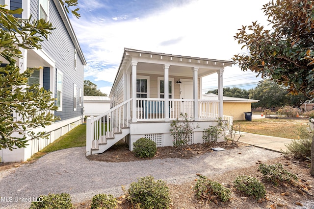 shotgun-style home with a porch