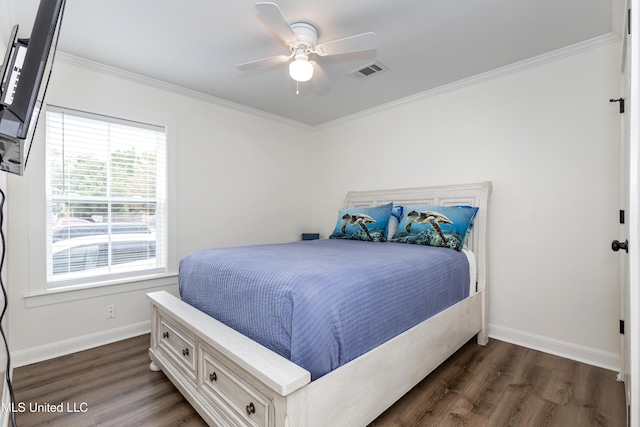 bedroom featuring crown molding, baseboards, visible vents, and dark wood finished floors