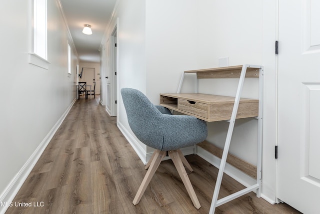 office space with baseboards and wood finished floors