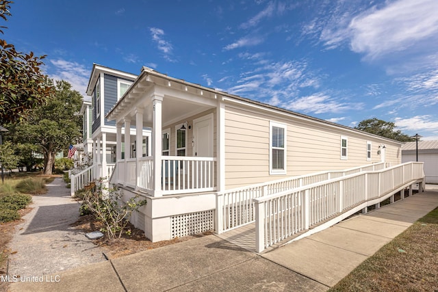 view of property exterior with covered porch
