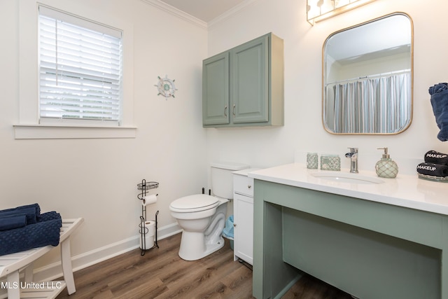 full bathroom with toilet, ornamental molding, vanity, and wood finished floors