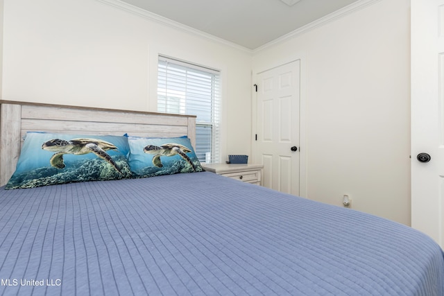 bedroom with ornamental molding