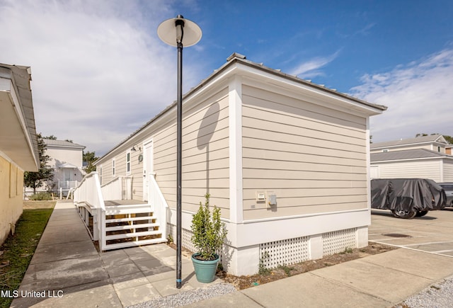 view of side of home featuring crawl space