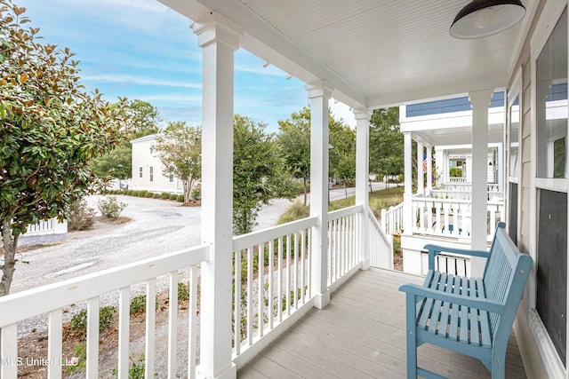 wooden terrace featuring a porch
