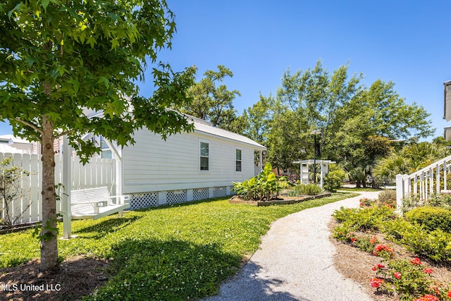 view of property exterior featuring a yard