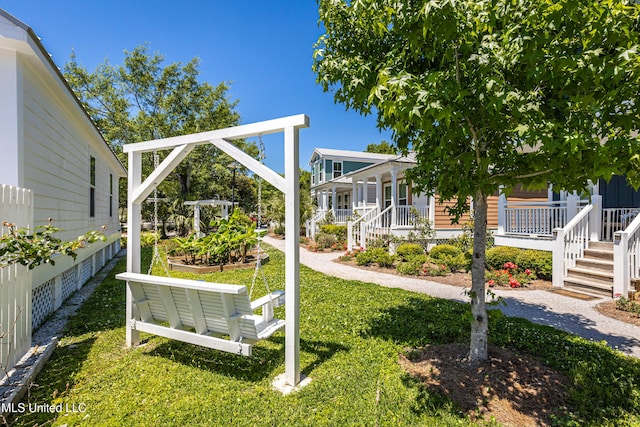 view of yard featuring covered porch
