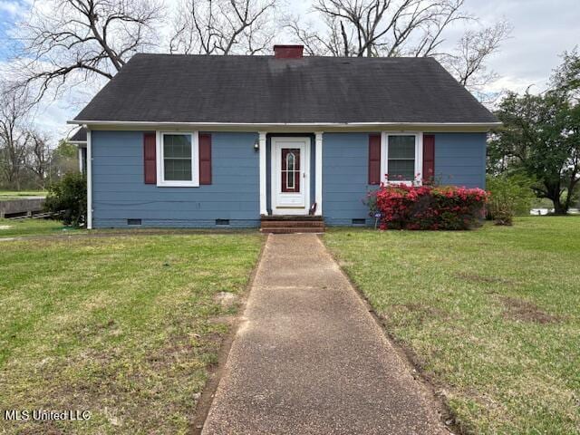 301 Hampton St, Indianola, MS 38751 - view of front of house featuring crawl space, a chimney, and a front yard