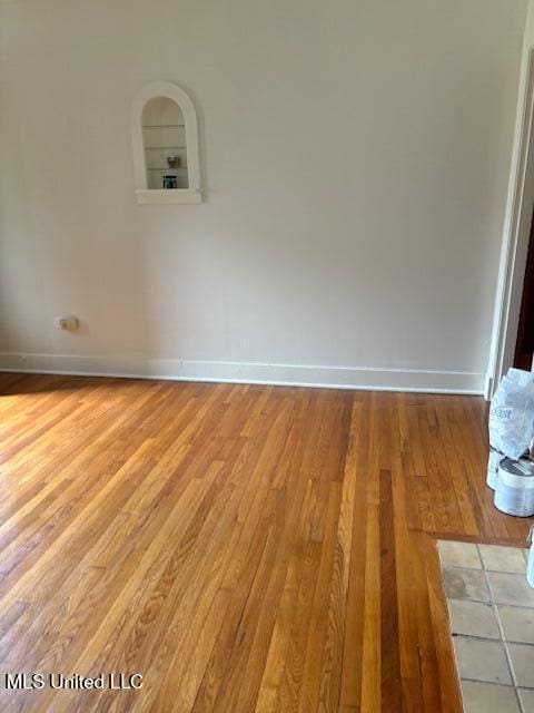 301 Hampton St, Indianola, MS 38751 - empty room featuring light wood finished floors and baseboards