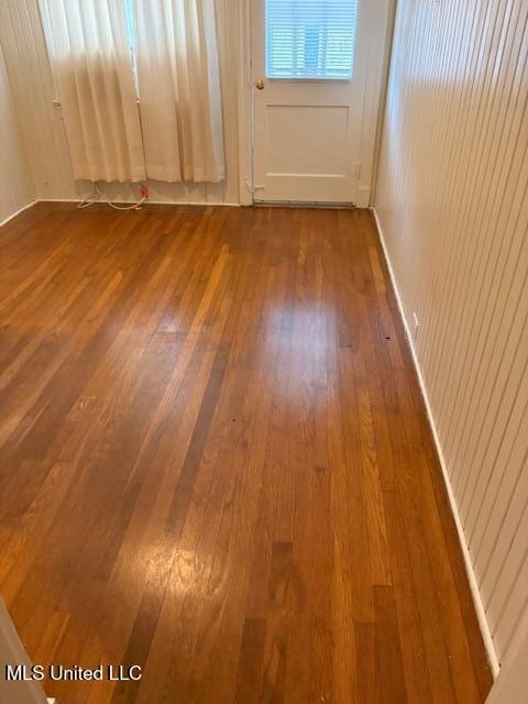 301 Hampton St, Indianola, MS 38751 - spare room with dark wood-style floors