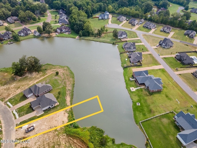 birds eye view of property with a residential view and a water view