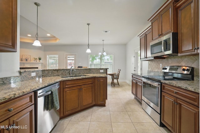 13111 Hawthorn Dr, Biloxi, MS 39532 - kitchen with appliances with stainless steel finishes, a sink, decorative backsplash, light tile patterned flooring, and recessed lighting