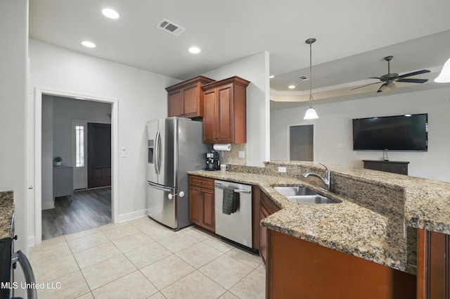 13111 Hawthorn Dr, Biloxi, MS 39532 - kitchen featuring appliances with stainless steel finishes, a sink, a peninsula, ceiling fan, and recessed lighting