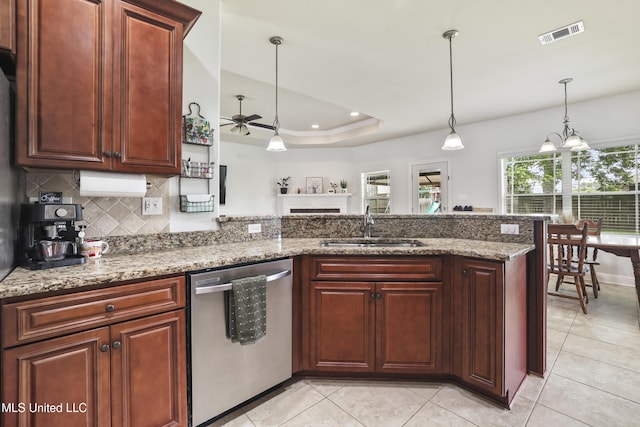 13111 Hawthorn Dr, Biloxi, MS 39532 - kitchen with dishwasher, a sink, ceiling fan, a peninsula, and decorative light fixtures