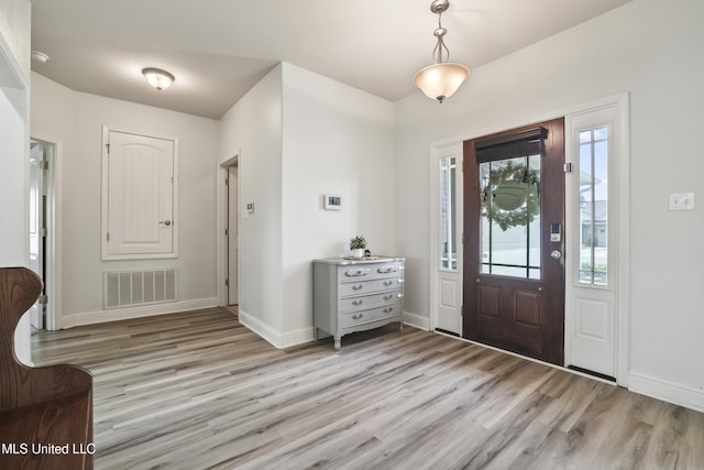 13111 Hawthorn Dr, Biloxi, MS 39532 - foyer entrance with light wood-style floors and baseboards