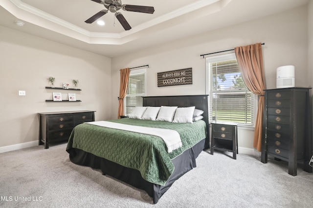 13111 Hawthorn Dr, Biloxi, MS 39532 - bedroom featuring a raised ceiling, ornamental molding, carpet, multiple windows, and baseboards