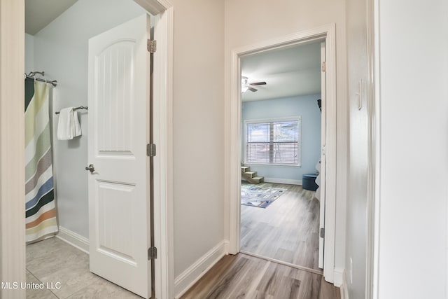 13111 Hawthorn Dr, Biloxi, MS 39532 - corridor featuring baseboards and wood finished floors