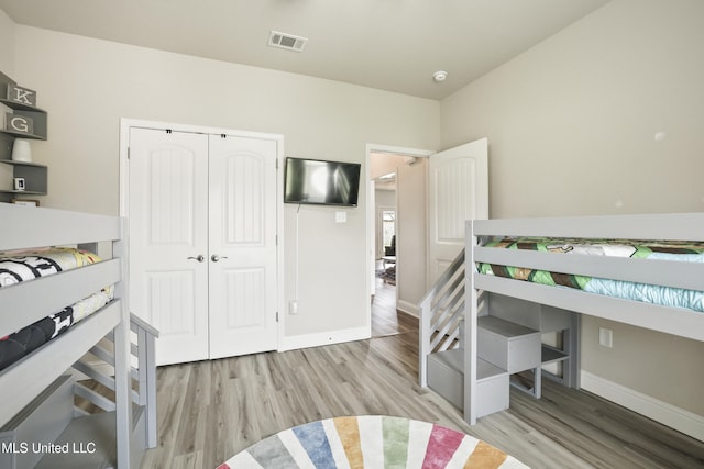 13111 Hawthorn Dr, Biloxi, MS 39532 - bedroom with wood finished floors, baseboards, and a closet