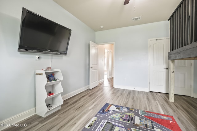 13111 Hawthorn Dr, Biloxi, MS 39532 - unfurnished living room featuring light wood finished floors, baseboards, and a ceiling fan