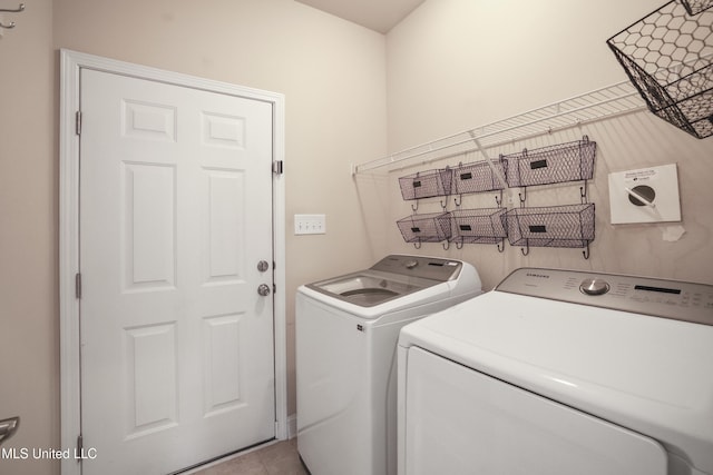 13111 Hawthorn Dr, Biloxi, MS 39532 - laundry area featuring independent washer and dryer and tile patterned floors