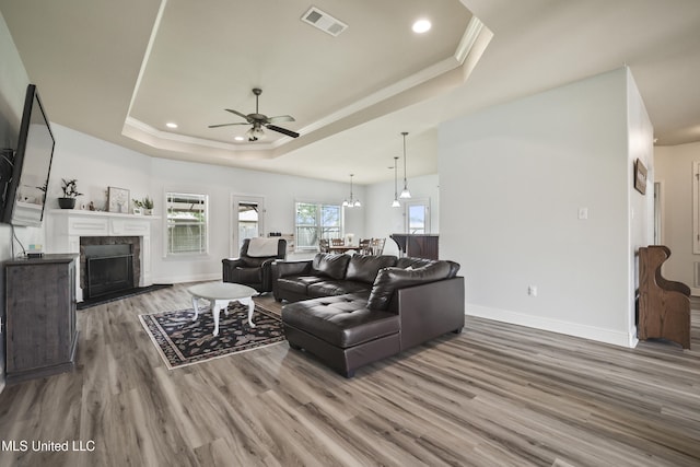 13111 Hawthorn Dr, Biloxi, MS 39532 - living room with a raised ceiling, wood finished floors, a ceiling fan, baseboards, and recessed lighting