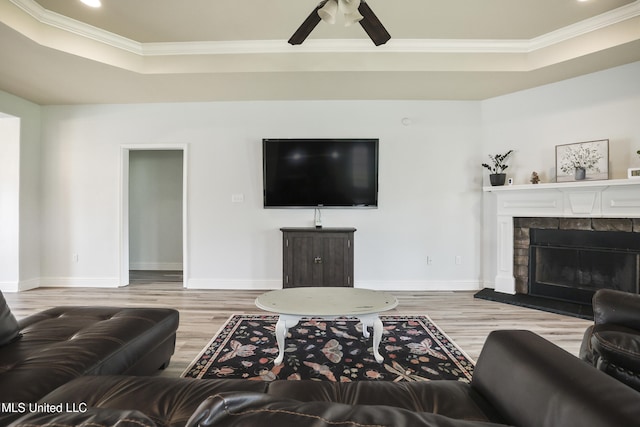 13111 Hawthorn Dr, Biloxi, MS 39532 - living room featuring crown molding, wood finished floors, a raised ceiling, baseboards, and recessed lighting