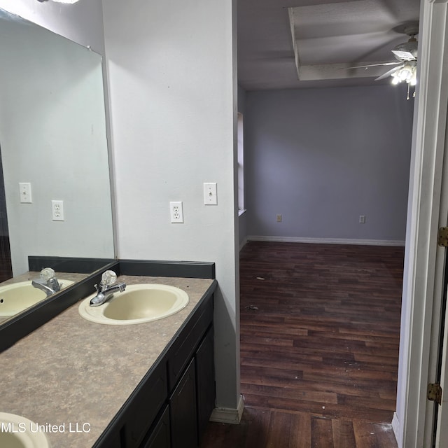 bathroom featuring vanity, hardwood / wood-style flooring, and ceiling fan