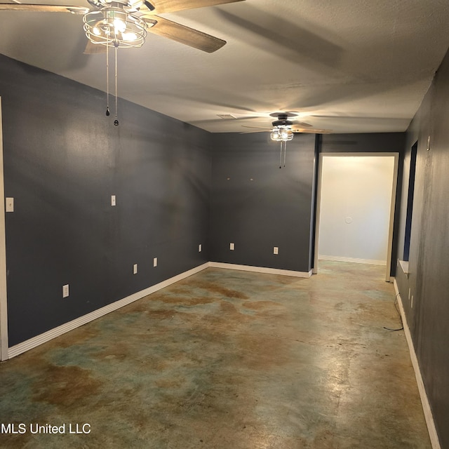 unfurnished room with concrete flooring and ceiling fan