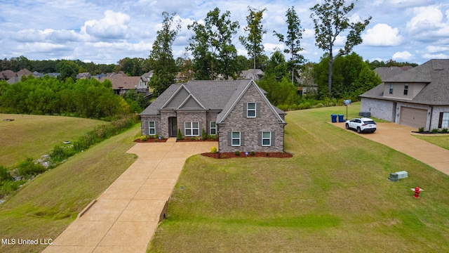 view of front of property featuring a front lawn and a garage