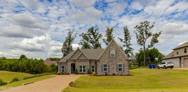 view of front of house featuring a front yard and a garage