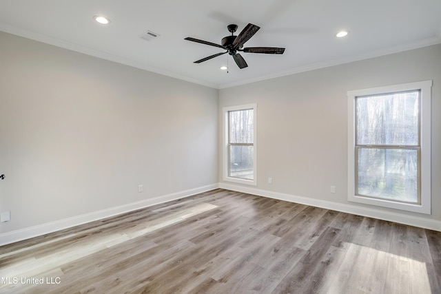 unfurnished room featuring crown molding, ceiling fan, and light wood-type flooring