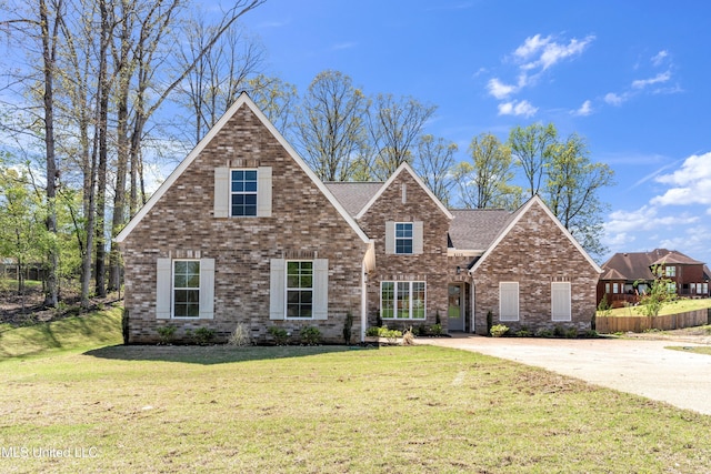 view of front of property with central AC, brick siding, and roof with shingles