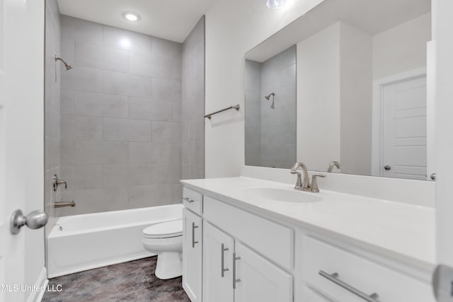 bathroom featuring shower / tub combination, vanity, and toilet