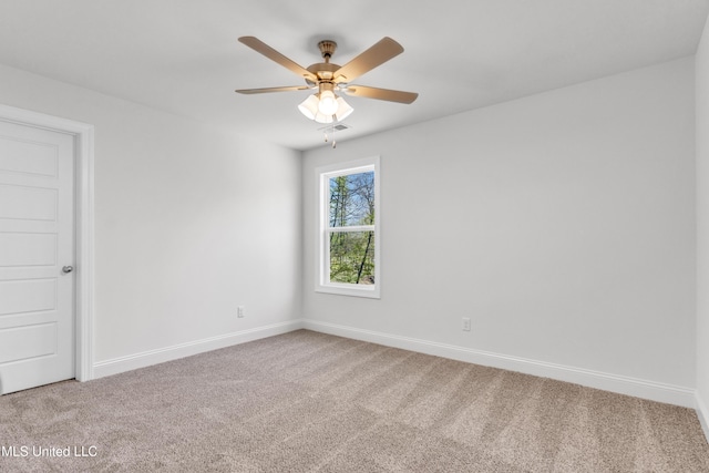 unfurnished room featuring ceiling fan, carpet flooring, and baseboards