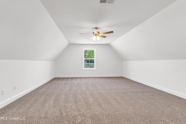 walk in closet with dark colored carpet