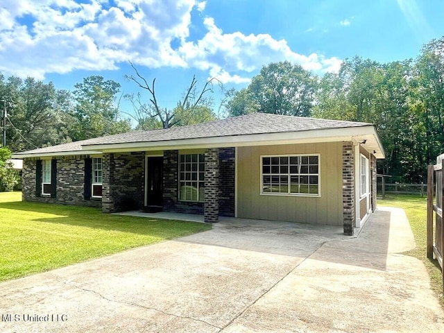 single story home featuring a garage and a front yard