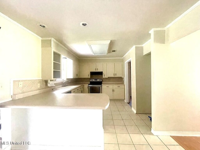 kitchen featuring stainless steel range with electric stovetop, white cabinets, sink, light tile patterned floors, and kitchen peninsula