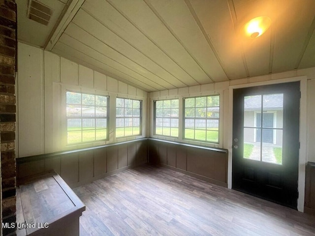 unfurnished sunroom with wooden ceiling and lofted ceiling