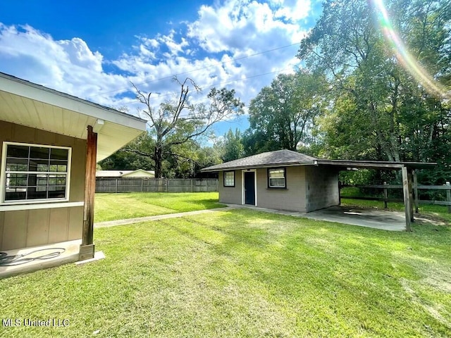 view of yard with a carport