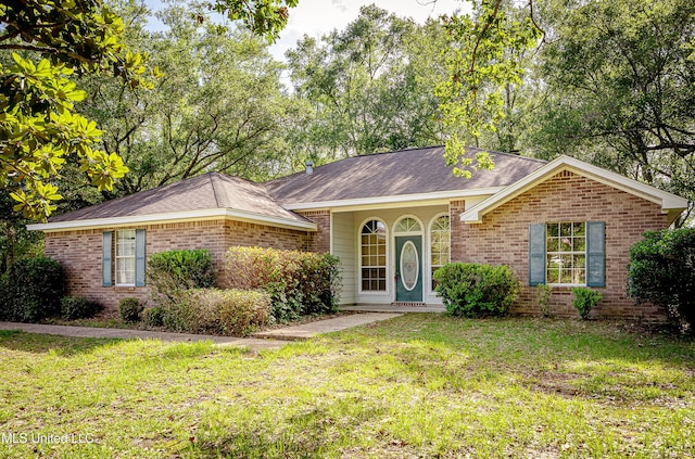 8113 Barron Rd, Moss Point, MS 39562 - ranch-style house featuring brick siding, a front yard, and roof with shingles