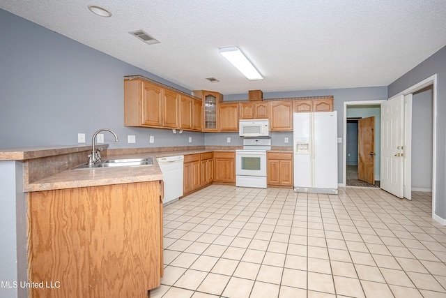 8113 Barron Rd, Moss Point, MS 39562 - kitchen with white appliances, a sink, glass insert cabinets, a textured ceiling, and light countertops