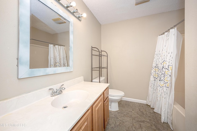 8113 Barron Rd, Moss Point, MS 39562 - full bathroom featuring toilet, a textured ceiling, vanity, and baseboards