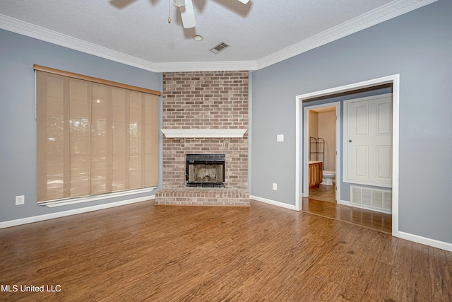 8113 Barron Rd, Moss Point, MS 39562 - unfurnished living room with a ceiling fan, wood finished floors, crown molding, a fireplace, and baseboards