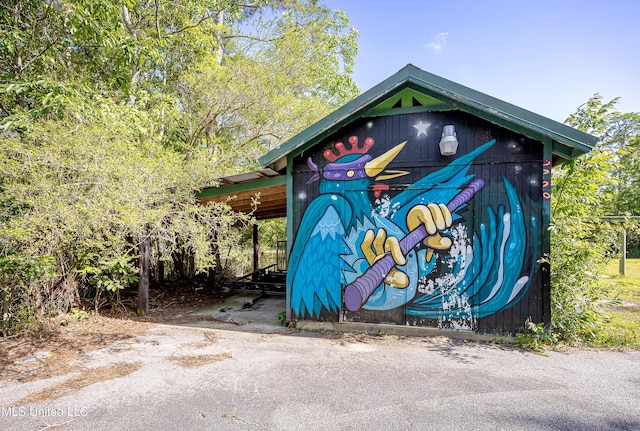8113 Barron Rd, Moss Point, MS 39562 - view of outbuilding with a carport
