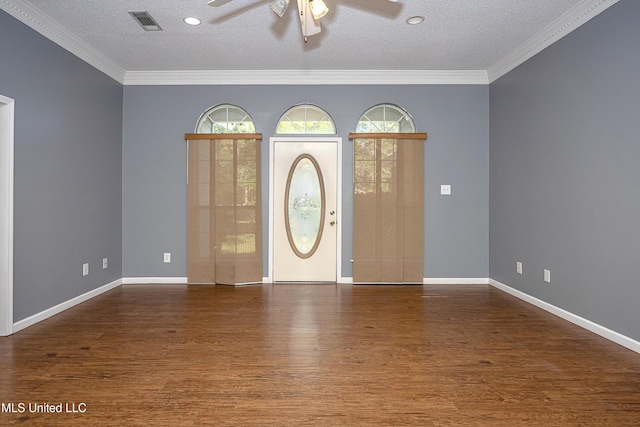 8113 Barron Rd, Moss Point, MS 39562 - entrance foyer featuring ceiling fan, wood finished floors, plenty of natural light, a textured ceiling, and crown molding
