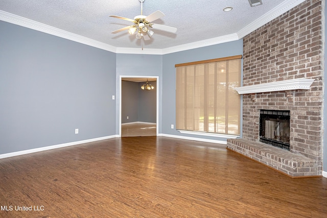 8113 Barron Rd, Moss Point, MS 39562 - unfurnished living room with a textured ceiling, wood finished floors, a fireplace, ceiling fan, and baseboards