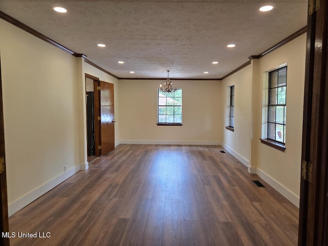 329 Arapaho Ln, Madison, MS 39110 - spare room featuring ornamental molding, a chandelier, recessed lighting, dark wood-style floors, and a textured ceiling