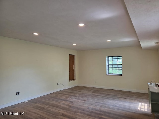 329 Arapaho Ln, Madison, MS 39110 - spare room with dark wood-type flooring and recessed lighting