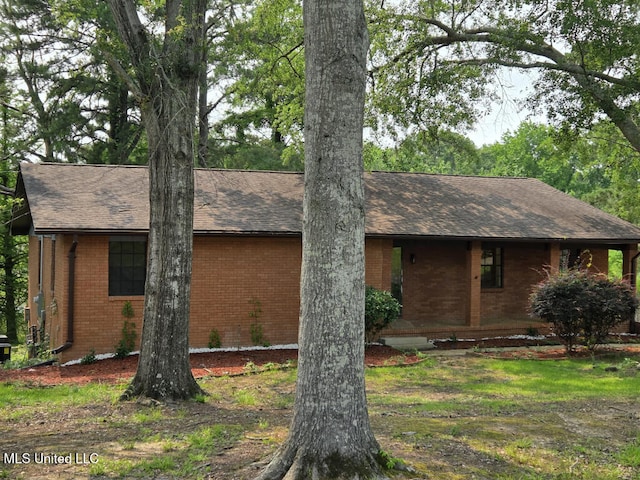 329 Arapaho Ln, Madison, MS 39110 - view of front facade featuring brick siding and a shingled roof