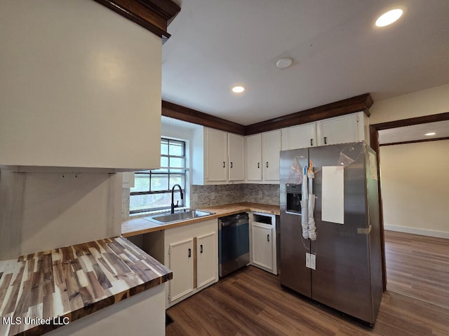 329 Arapaho Ln, Madison, MS 39110 - kitchen featuring appliances with stainless steel finishes, white cabinets, butcher block countertops, backsplash, and recessed lighting
